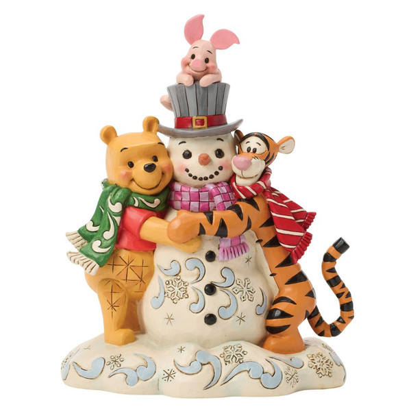 Alt 1: Jim Shore Disney Traditions Pooh & Friends Snowman figurine featuring Winnie the Pooh, Tigger, and Piglet hugging a snowman.

Alt 2: Hand-painted stone resin Disney holiday figurine with Pooh, Tigger, Piglet, winter scarves, glitter accents, and a snowman.

Alt 3: Disney Traditions "A Chilly Creation" figurine showing Pooh and friends enjoying a snowy winter scene.