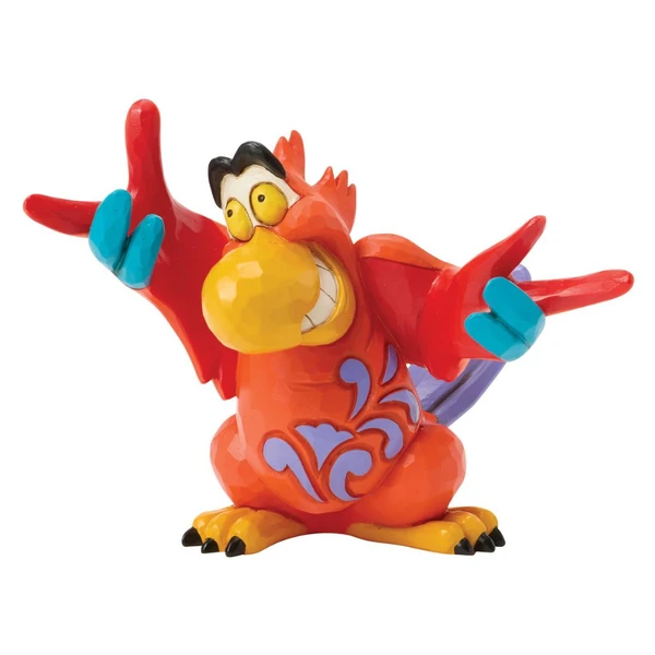 Alt Text 1:
Jim Shore Disney Traditions Iago Mini figurine featuring the colorful parrot from Disney's Aladdin with arms spread wide.

Alt Text 2:
Hand-painted stone resin Iago mini collectible with vibrant red feathers, purple tail, and Jim Shore folk-art detailing.

Alt Text 3:
Front view of Jim Shore Disney Traditions Iago Mini figurine with expressive grin and quilt-inspired decorative accents.