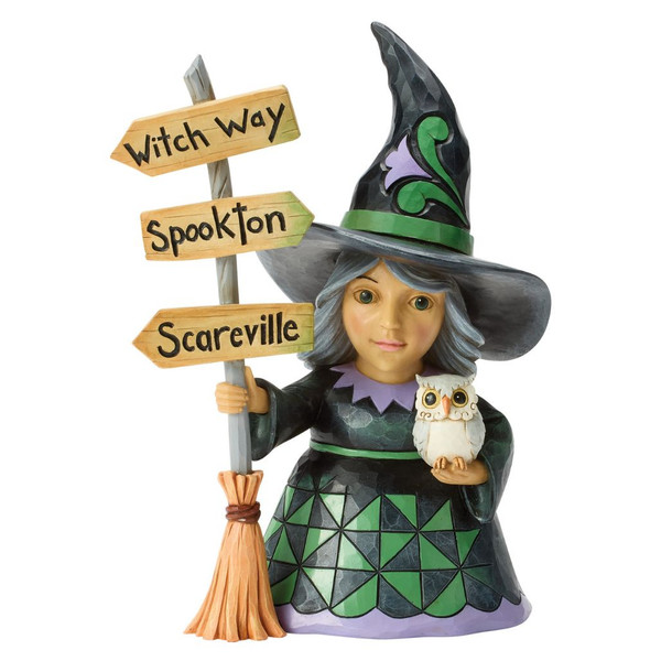 Jim Shore Good Witch figurine holding an owl beside a broom-shaped Halloween signpost with whimsical directional signs.
Hand-painted Heartwood Creek stone resin witch in black, green, and purple with quilt-inspired patterns and rosemaling details.
Halloween collectible featuring a friendly witch, owl, broom, and sign pointing toward Witch Way, Spookton, and Scareville.