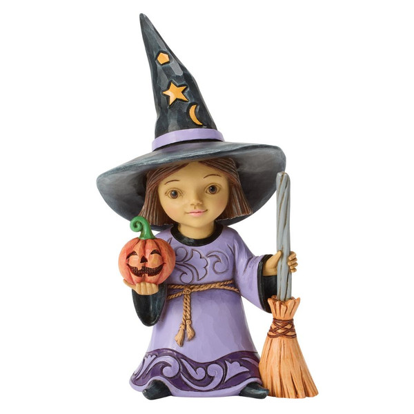 Jim Shore witch figurine wearing a purple gown and starry black hat while holding a broom and smiling jack-o'-lantern.
Hand-painted Heartwood Creek stone resin Halloween witch with folk-art rosemaling details and whimsical expression.
Halloween tabletop figurine featuring a young witch carrying a pumpkin and broom with classic Jim Shore styling.