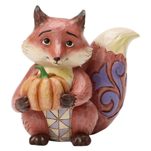 Jim Shore Heartwood Creek fox figurine holding a pumpkin with purple rosemaling details on its tail.
Hand-painted stone resin fox collectible featuring quilt-inspired folk-art patterns and harvest colors.
Woodland fox autumn figurine with a pumpkin from the Jim Shore Heartwood Creek Harvest Collection.