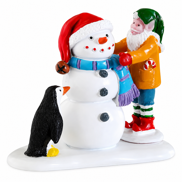 Lemax Building A Snowman resin village figurine featuring an elf and penguin making a snowman.
Santa's Wonderland miniature accessory with a snowman wearing a blue scarf and Santa hat.
Non-electrical resin Christmas village figurine measuring approximately 1.9 inches tall.