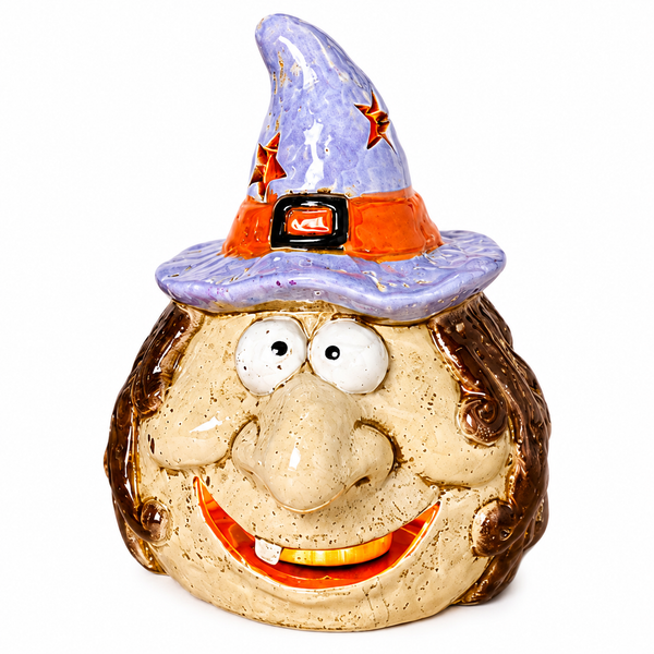 Purple Hat Witch stoneware candle holder with brown hair and a smiling face.
Halloween witch candle holder with glossy purple pointed hat, orange band, buckle and star cutouts.
5.9-inch stoneware witch candle holder with open illuminated smile and included wax tea light.