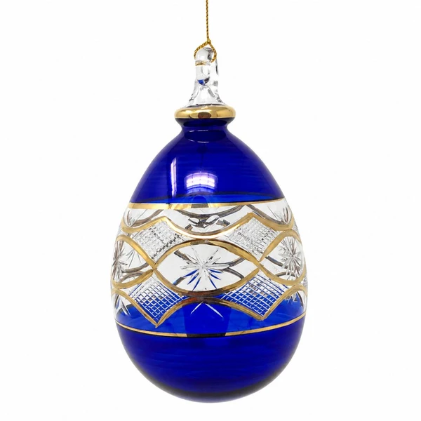 Handmade Egyptian Museum cobalt blue glass egg ornament with hand-etched geometric patterns and genuine gold accents.
Mouth-blown glass egg-shaped Christmas ornament measuring 5.5 inches with artisan-etched detailing.
Elegant handcrafted cobalt blue glass ornament featuring etched decorative designs and gold trim.
