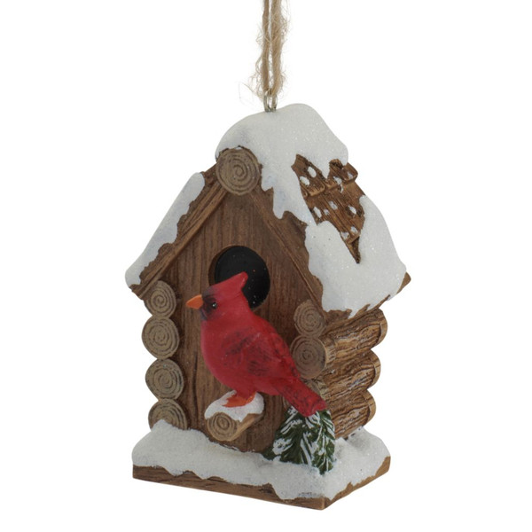 3-inch resin ornament featuring a red cardinal perched on a snowy birdhouse.

Red cardinal and rustic log-style birdhouse ornament with snow-covered roof.

Resin Christmas ornament with cardinal, brown birdhouse, snow, and evergreen details.