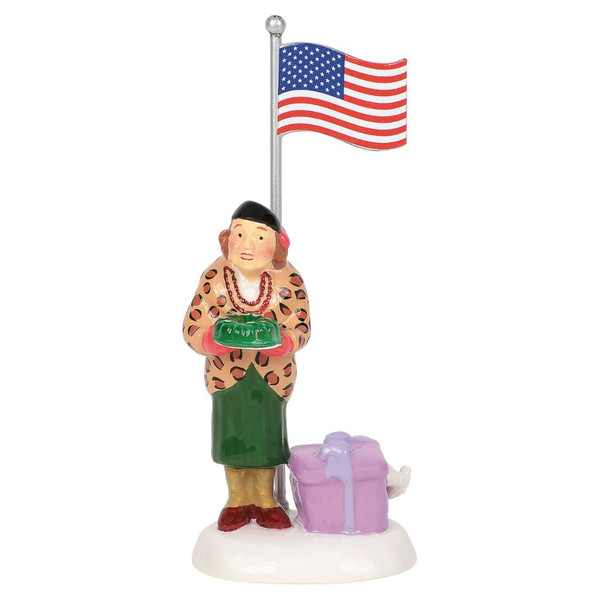 Department 56 Snow Village Play Ball! figurine featuring Aunt Bethany holding a green gelatin mold beneath an American flag.
Hand-painted National Lampoon's Christmas Vacation village collectible with wrapped gift on snowy base.
Snow Village ceramic holiday figurine measuring approximately 2.95 inches tall.