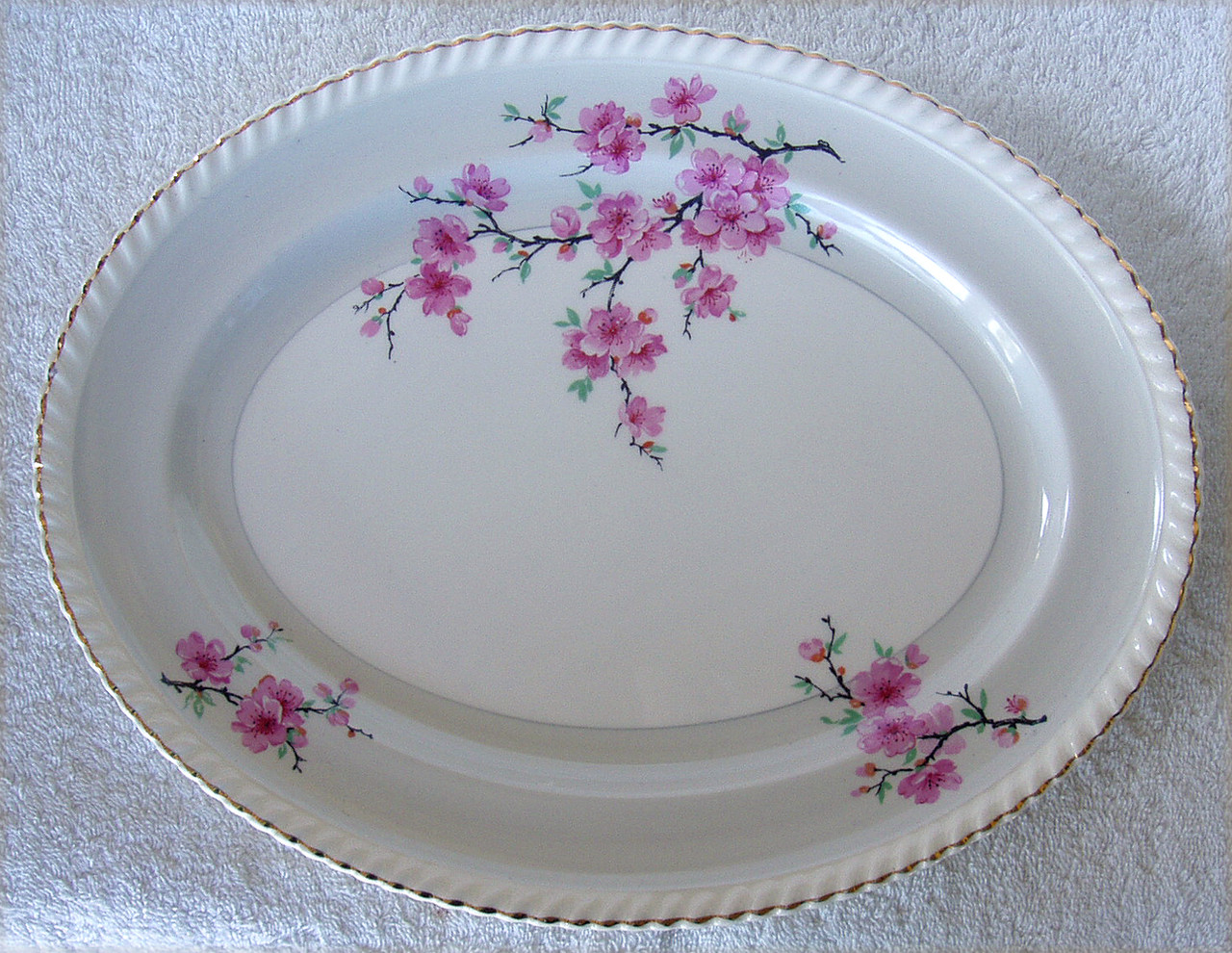 https://cdn11.bigcommerce.com/s-ly3sihrdwc/images/stencil/1280x1280/products/10531/56582/SANDWICH_SERVING_PLATE_Old_English_Porcelain_JOHNSON_BROTHERS_Cherry_Blossoms_JB734_Hand_Decorated__67761.1690856541.jpg?c=2
