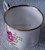 One coffee cup - a topside rim chip