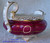 This Creamer Jug has two of these tiny White "dots" within the Burgundy banding, on opposite sides of the jug .