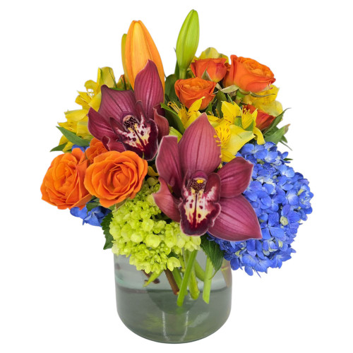 A burst of pure joy and sunshine! Bright, energetic colors come together to create an instantly uplifting arrangement that delivers warmth, smiles, and feel-good vibes to any room