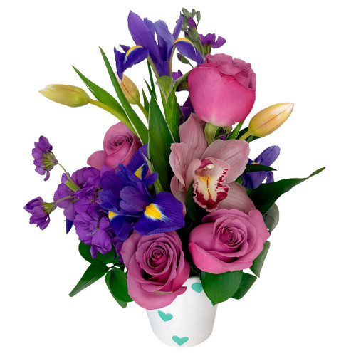 Brighten someone's day with a stunning burst of jewel-toned hues and exquisite elegance. This charming arrangement combines regal purples and rich pinks to create a deeply captivating and heartfelt gift for any special moment