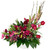 A lush, asymmetric statement piece featuring striking height, dramatic color depth, and dynamic textural elements