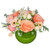 Celebrate the warmth of autumn with Cherished! Featuring peach garden roses, soft blush gerbera daisies, spray roses, and eucalyptus arranged in a sleek green bubble glass bowl. Perfect for adding fall elegance to any space