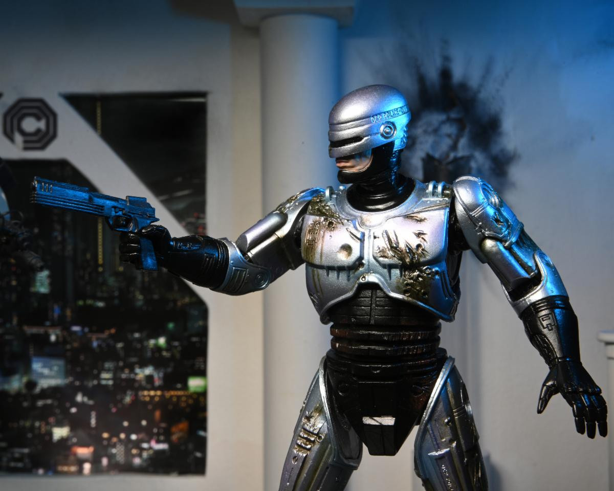 NECA Ultimate RoboCop 203605 - Action Figure 20 Cm Con Sedia Danneggiata - Licenza Ufficiale - Collezionabile Con Accessori