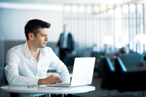 Man Working in Qantas Business Class Lounge Sydney Man Working in Qantas Business Class Lounge Sydney