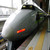 A sleek grey Hikari Shinkansen bullet train waiting at a Japanese station platform, illustrating how easily first-timers travel between Tokyo, Kyoto and Osaka by rail.