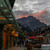 Banff Avenue shopfronts at dusk with Cascade Mountain rising above the township, Canadian Rockies