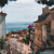 Steep cobbled street in Lisbon's Alfama district looking down to the Tagus River