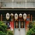 A doorway on Shennong Street in Tainan hung with paper lanterns and red banners.