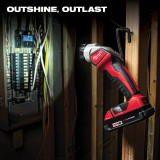 "Outshine, outlast" a Milwaukee M18™ Work Light that is hung on a board shining a bright light on a breaker panel at a construction site.