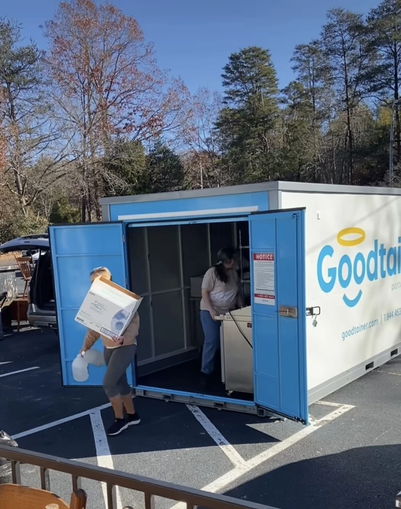 Homeowners loading a Goodtainer storage container during a home renovation in Spartanburg, SC
