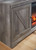 Wynnlow Gray 63'' TV Stand With Glass/Stone Fireplace Insert