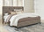 Wittland Brown California King Upholstered Panel Bed