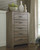 Zelen Warm Gray Five Drawer Chest