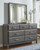 Caitbrook Gray 5 Pc. Dresser, Mirror, Queen Storage Bed With 8 Drawers