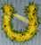 Horseshoe funeral flower tribute with yellow flowers and greenery