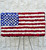 American Flag patriotic funeral standing spray handcrafted with red and white carnations and blue delphinium by Nancy's Floral in Gresham Oregon