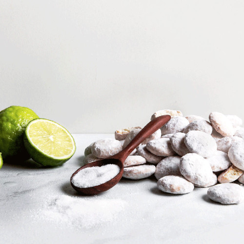 Key lime coolers scattered with sliced lime and wooden spoon. Key lime coolers scattered with sliced lime and wooden spoon.