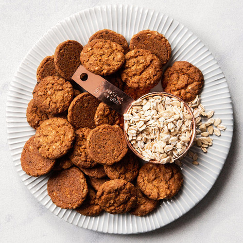 Scotch Oatmeal Cookies on plate with oats Scotch Oatmeal Cookies on plate with oats