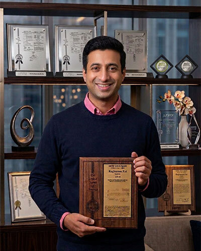 Inventor holding a personalized recognition award