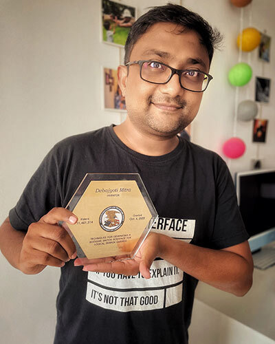 Inventor displaying a personalized patent award