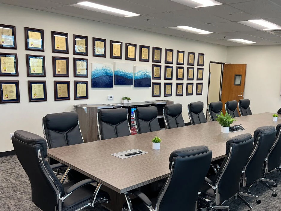 Cherry-framed patent display installed in a conference room