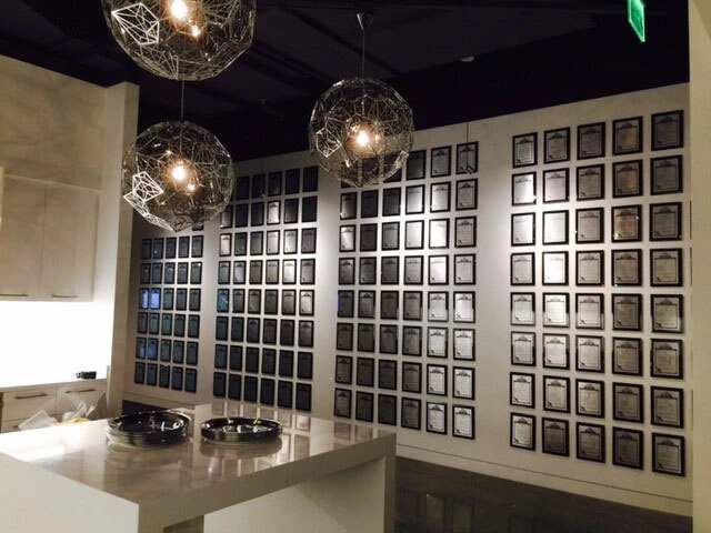 Large black glass patent wall in a modern corporate interior
