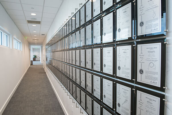 Custom patent wall installed in a corporate hallway