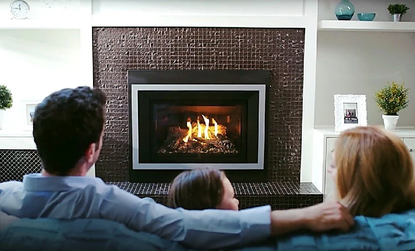 Family enjoying a Regency gas fireplace insert in their Connecticut home