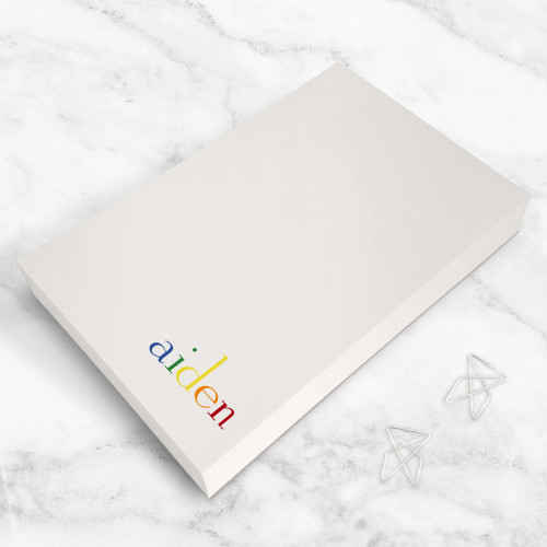 Rainbow personalized rectangular notepad showing a rainbow-colored name.