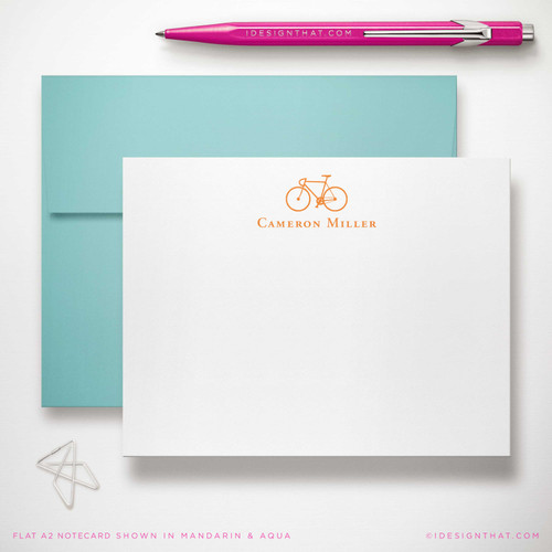 Bicycle flat notecard showing small bicycle and name with an aqua envelope.
