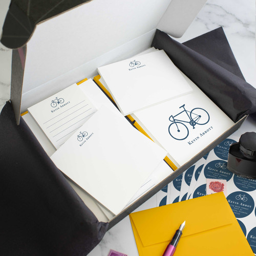 Bicycle personalized stationery gift set in an open box with coordinated notecards, notepads, envelopes, and stickers.