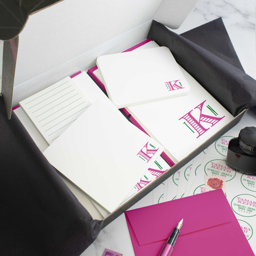 Chevalier personalized stationery gift set in an open box with coordinated notecards, notepads, envelopes, and stickers.