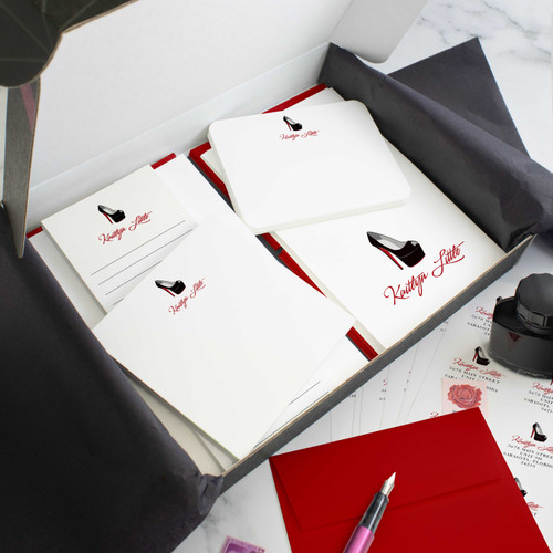 Red Bottoms personalized stationery gift set in an open box with coordinated notecards, notepads, envelopes, and stickers.