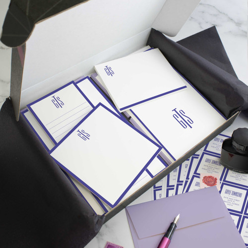 Slim Monogram personalized stationery gift set in an open box with coordinated notecards, notepads, envelopes, and stickers.