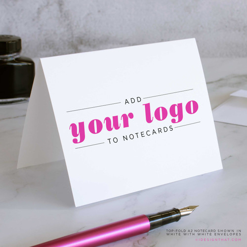 Add Your Own Logo folded notecard showing pink sample business logo on a card standing open.