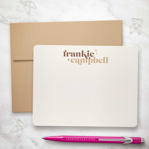 Wild Stardust flat notecard showing retro two-line name and rounded corners with a kraft envelope.