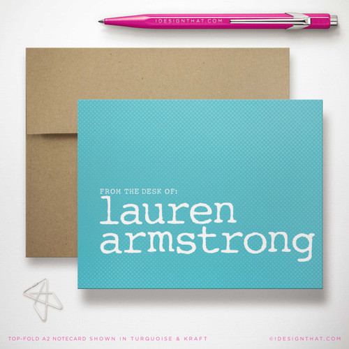 Typewriter Byline folded notecard showing white typewriter-style name on an aqua card with a kraft envelope.