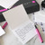 Inside of folded notecard stationery showing a letter in the process of being written.