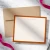 Personalized flat stationery for a couple with two names, an orange border, and coordinating neutral envelope.